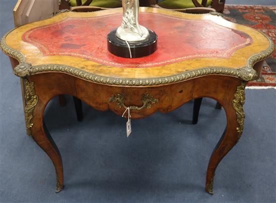 A Victorian walnut serpentine centre table, W.121cm